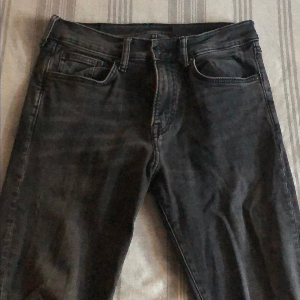 Distressed black skinny jeans